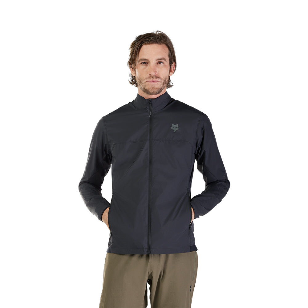 Man wearing a black jacket with a brand logo on a white background