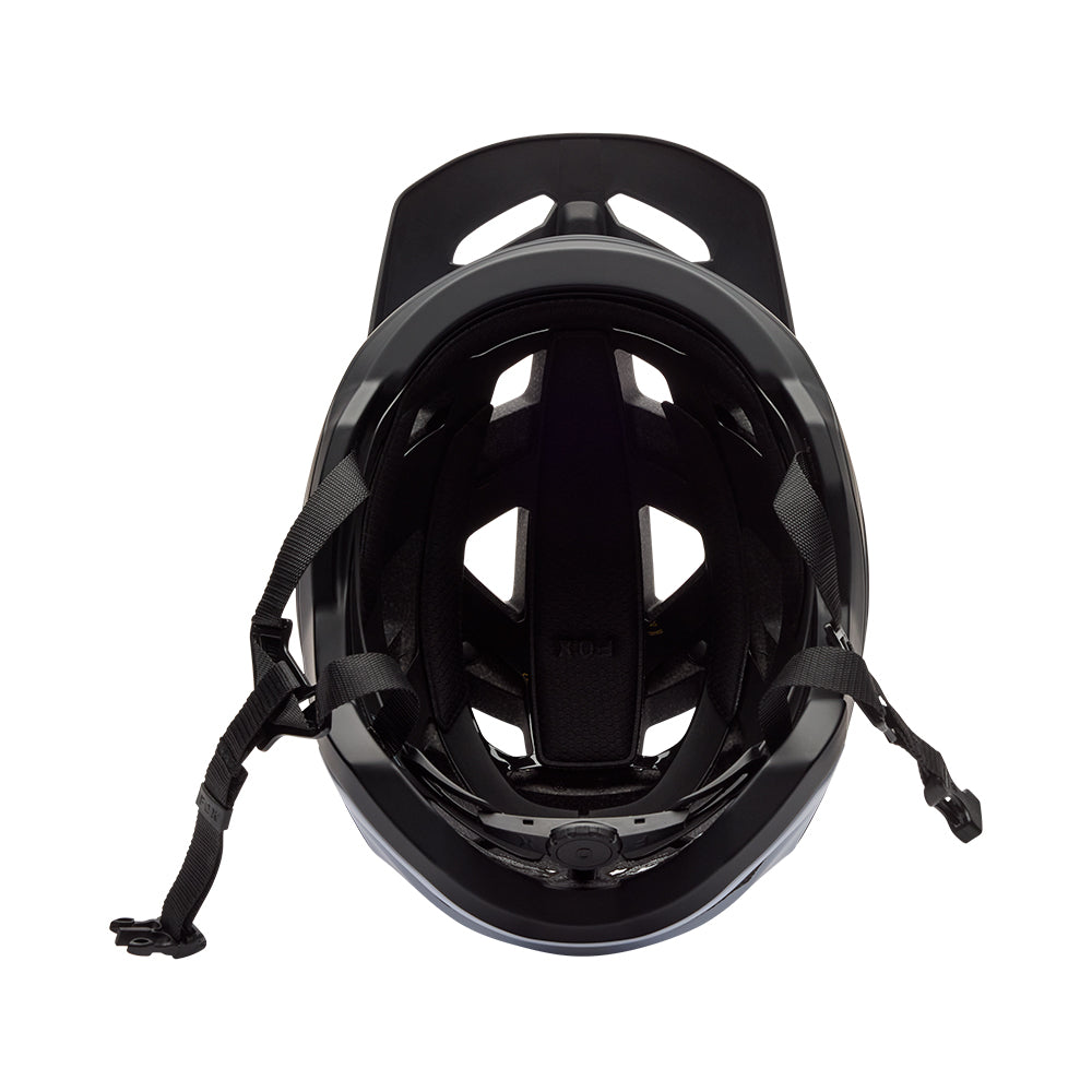Black helmet with chin strap on a white background