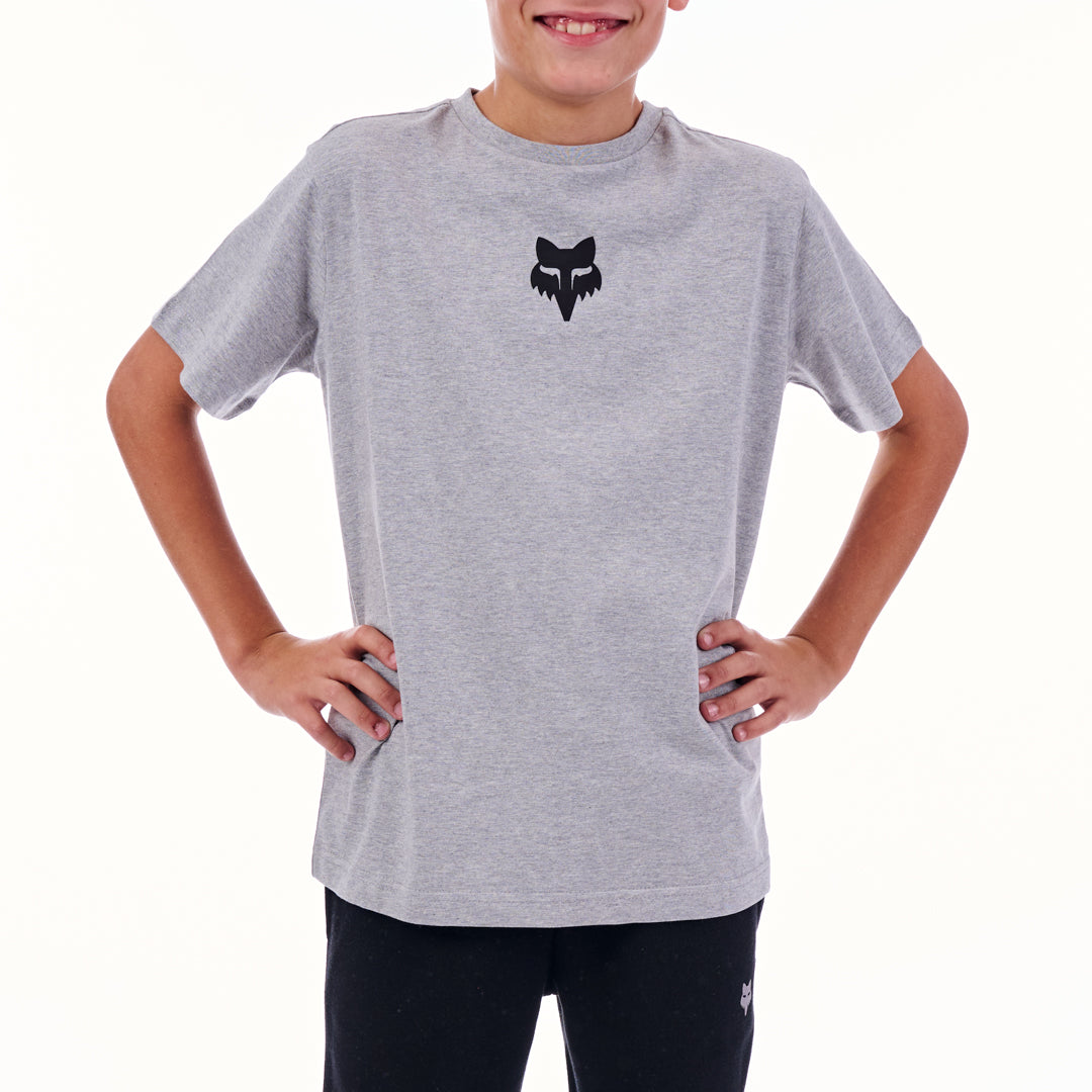 Child wearing a gray t-shirt with a black logo on a white background