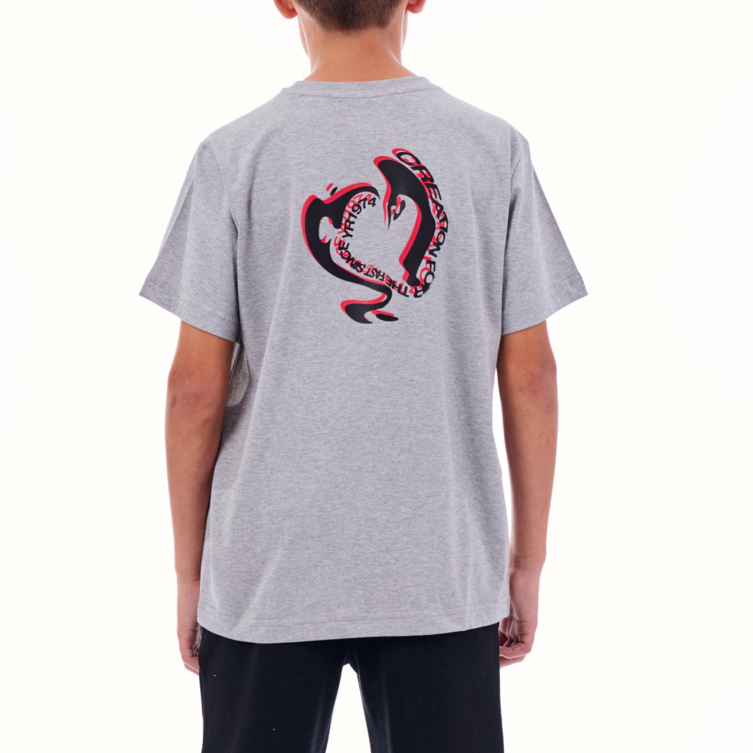 Person wearing a gray t-shirt with a red and black graphic on the back, on a white background