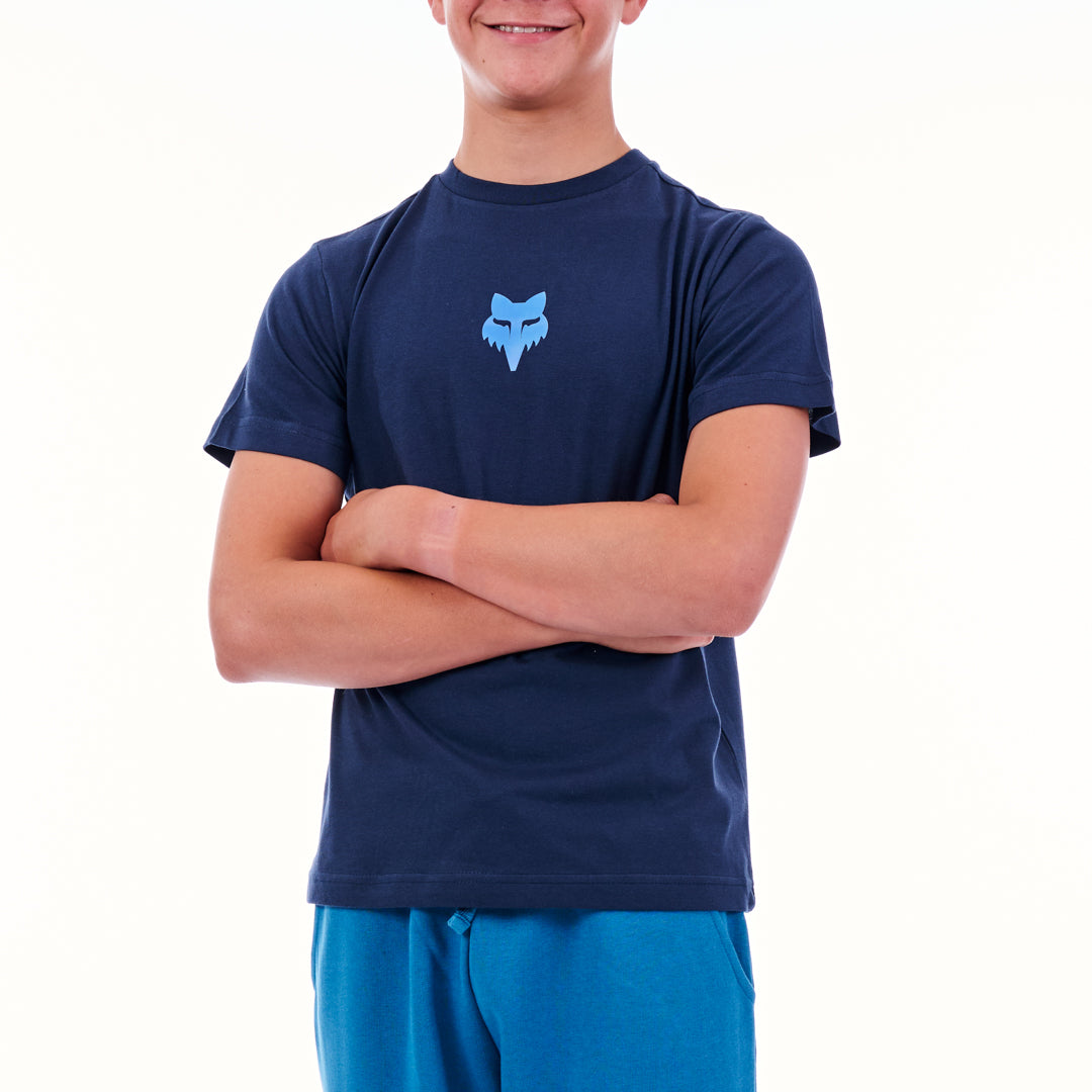Person wearing a navy blue t-shirt with a logo on a white background