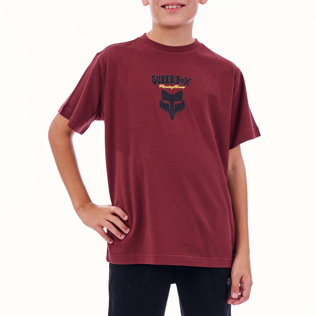 Child wearing a maroon t-shirt with a logo on a white background