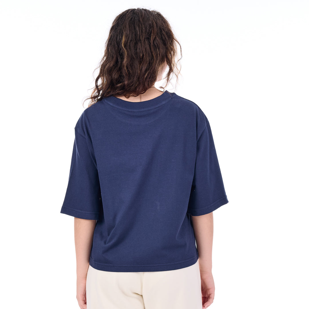 Person wearing a blue t-shirt on a white background
