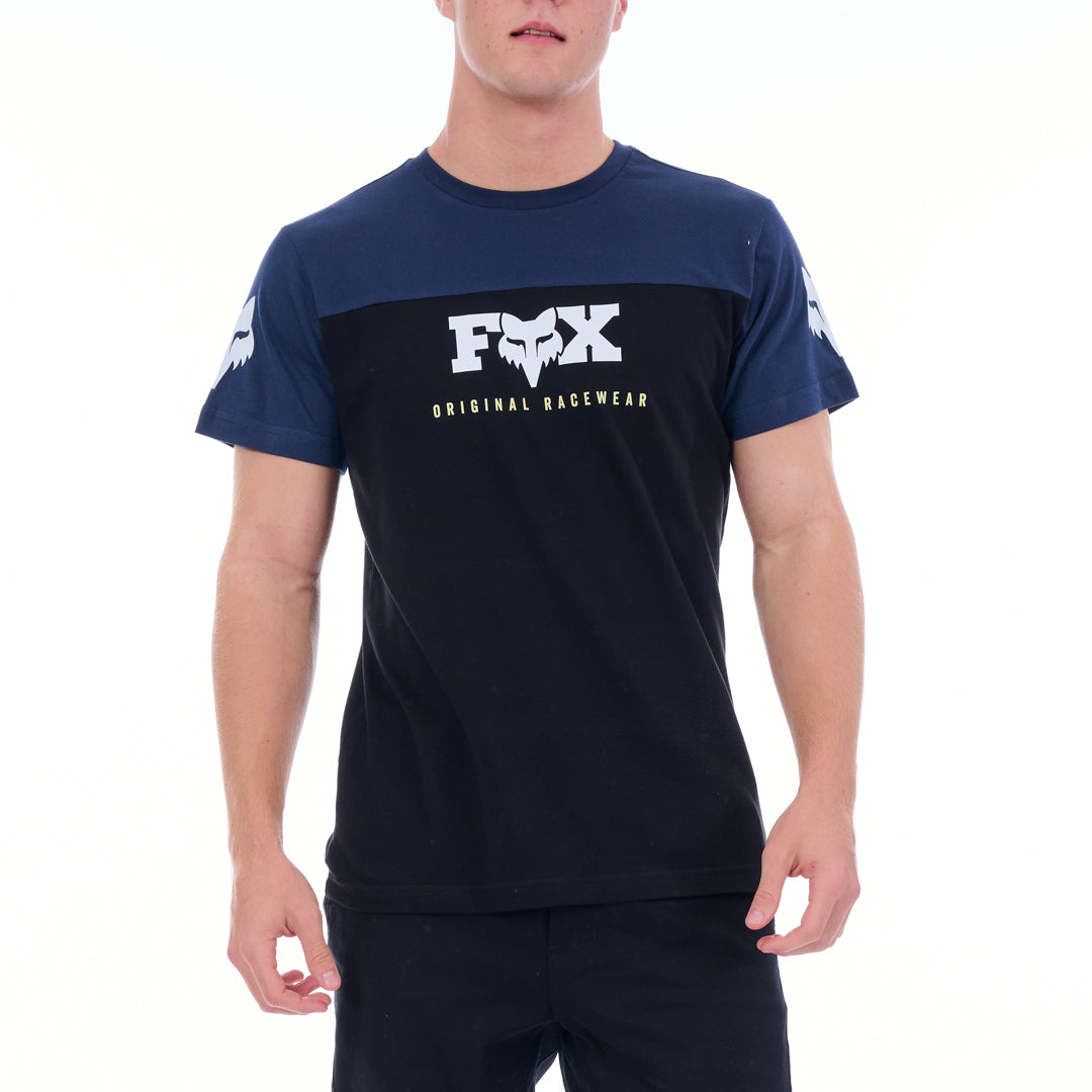 Person wearing a navy t-shirt with a white logo on a white background