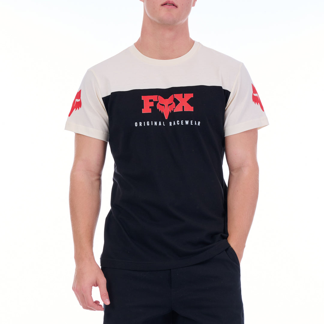 Person wearing a black and white t-shirt with a red logo on a white background