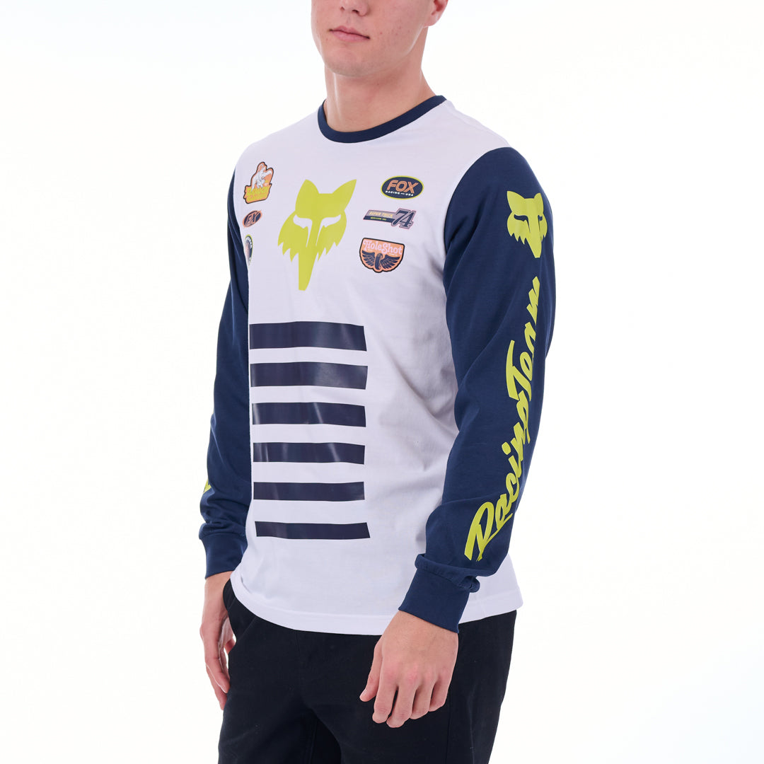 Person wearing a white and blue long-sleeve shirt with brand logos on a white background