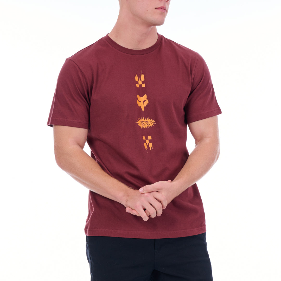 Person wearing a maroon t-shirt with orange graphics on a white background