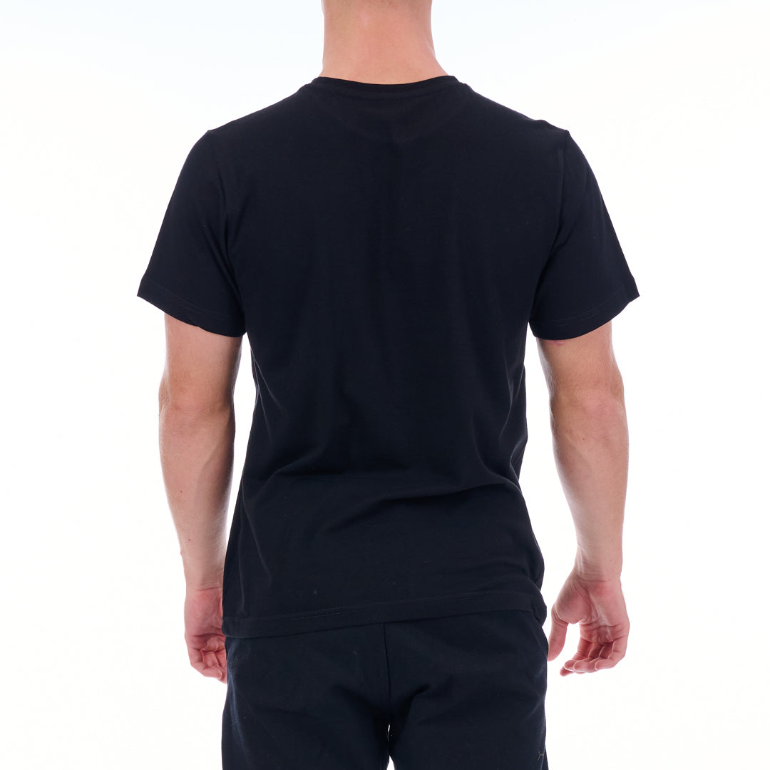 Person wearing a black t-shirt and pants on a white background
