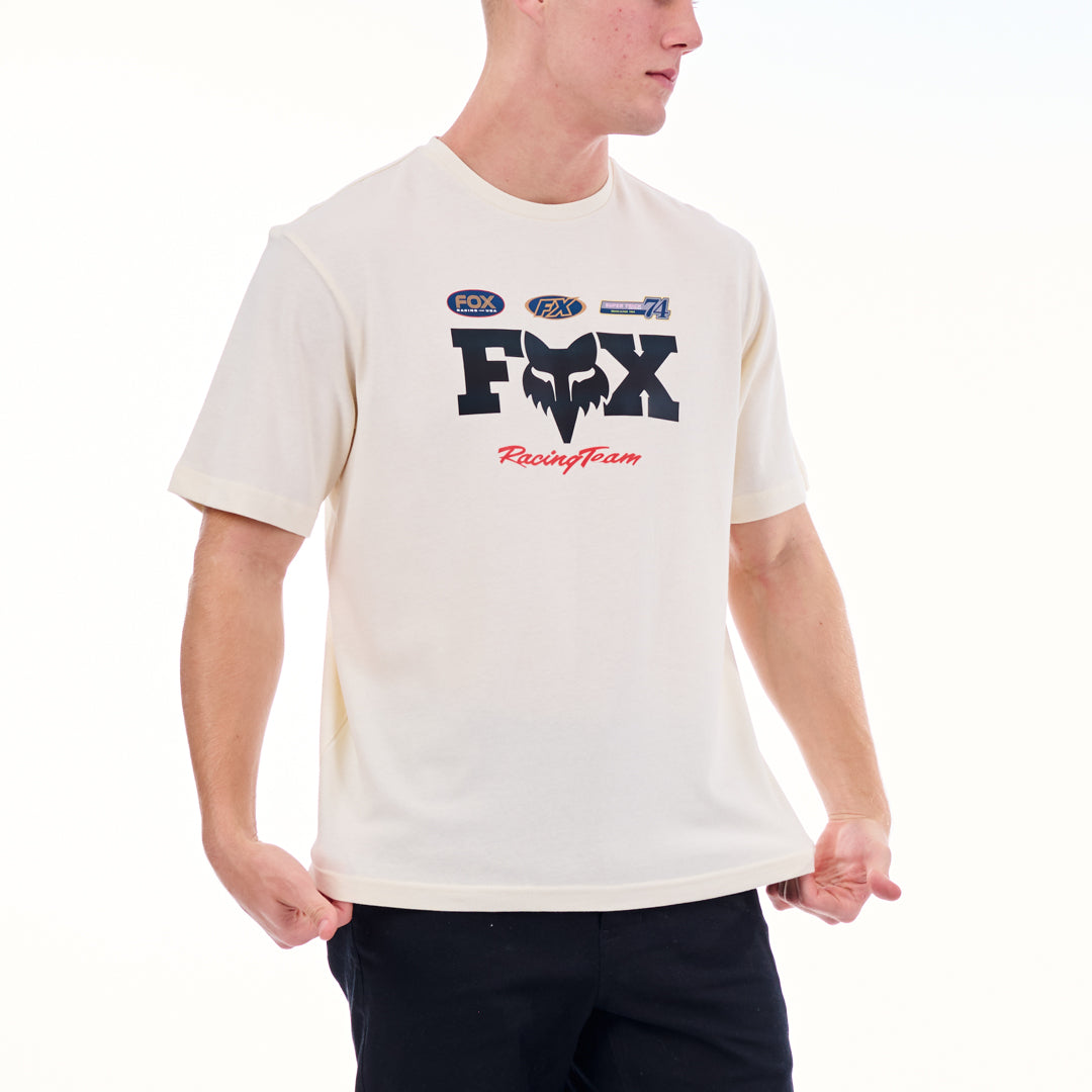 Person wearing a white t-shirt with a Fox Racing logo on a white background