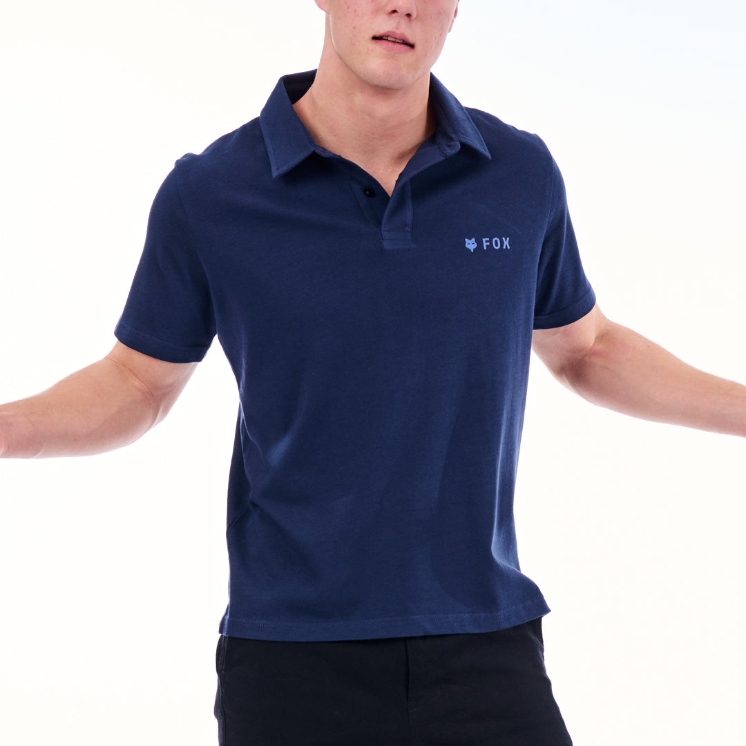 Person wearing a navy blue polo shirt with a brand logo on a white background