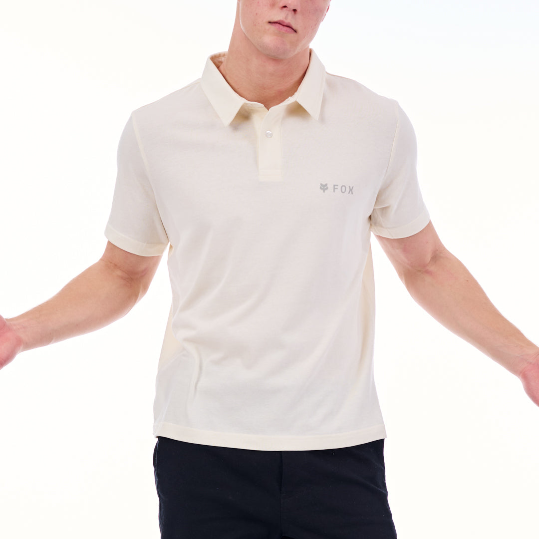 Person wearing a white polo shirt with a brand logo on a white background