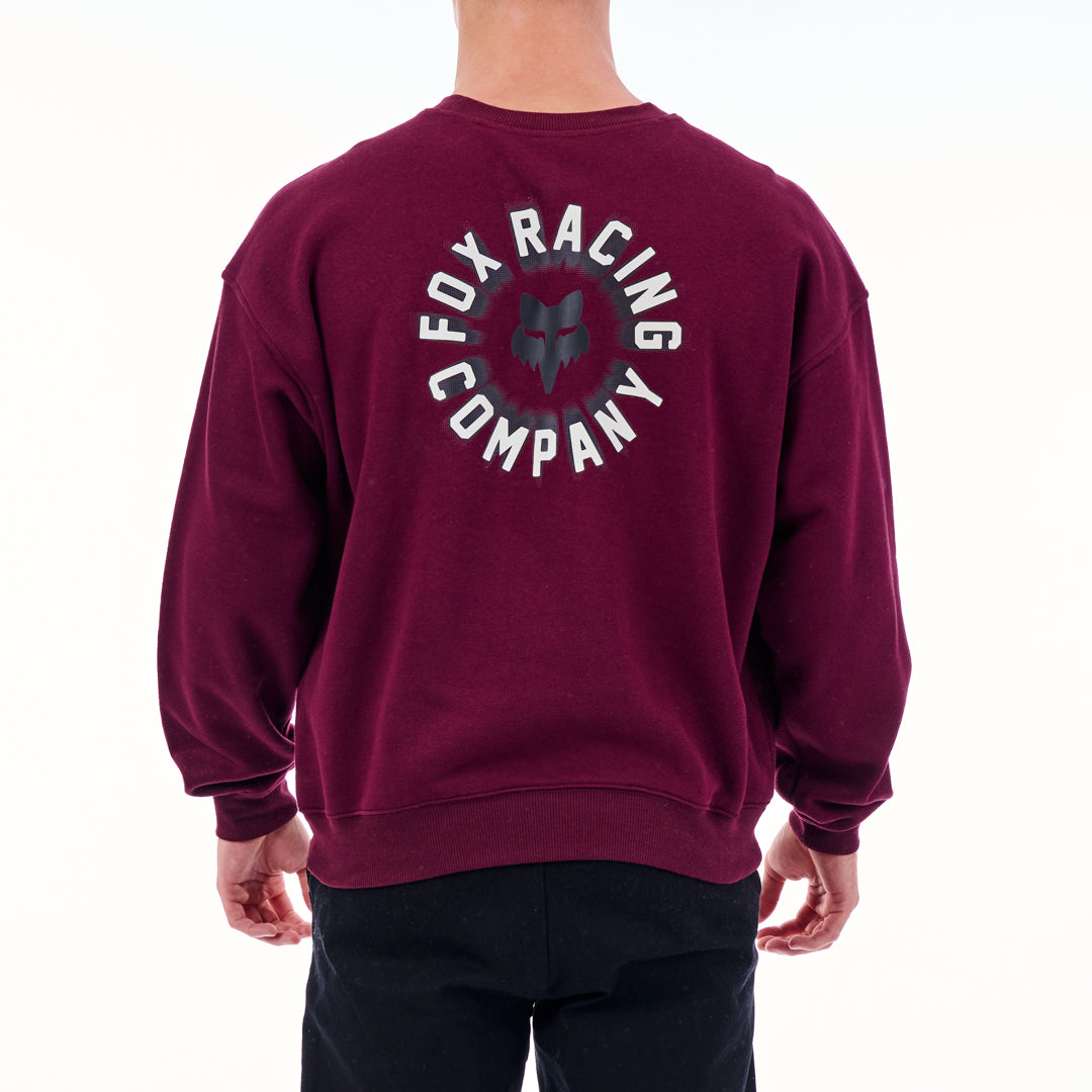 Maroon sweatshirt with 'Fox Racing Company' logo on the back, worn by a person.