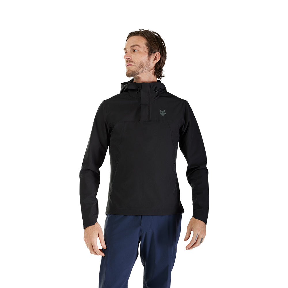 Man wearing a black pullover with a logo on a white background