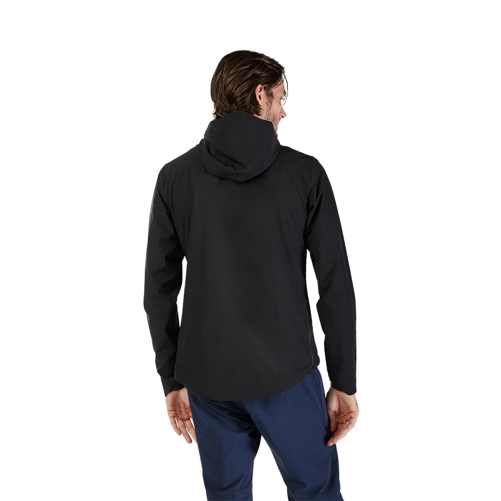 Person wearing a black jacket and blue pants on a white background