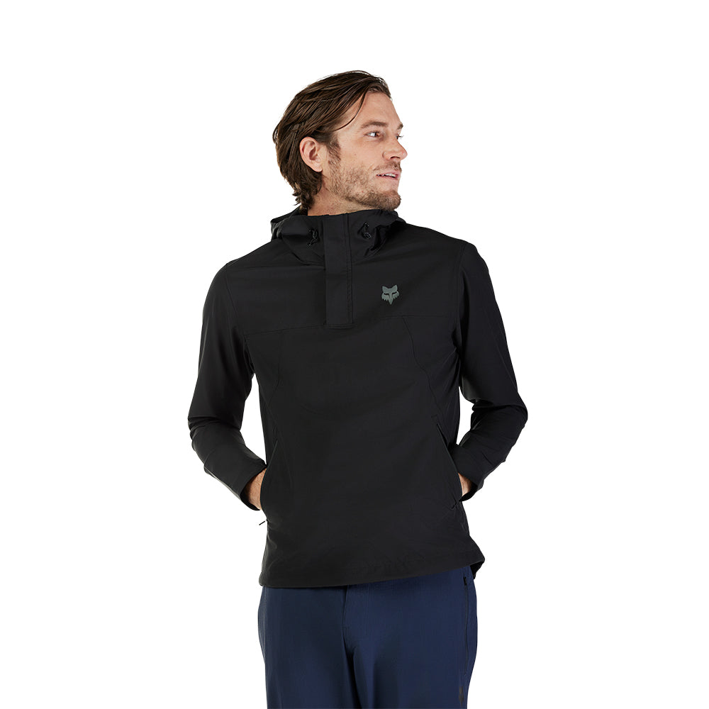 Man wearing a black pullover with a logo on a white background