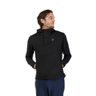 Man wearing a black pullover with a logo on a white background