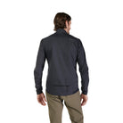 Man wearing a dark gray jacket with 'Fox' branding on the back, standing against a white background.