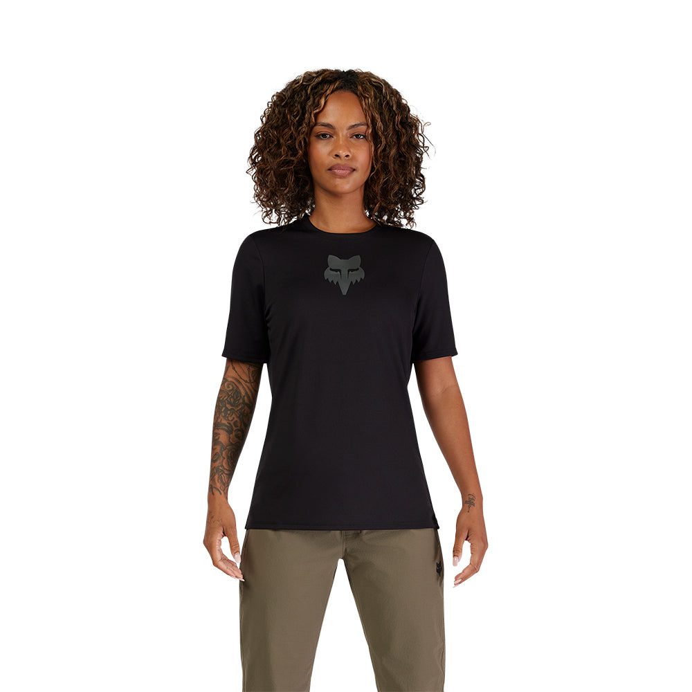 Person wearing a black t-shirt with a logo on a white background