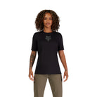 Person wearing a black t-shirt with a logo on a white background
