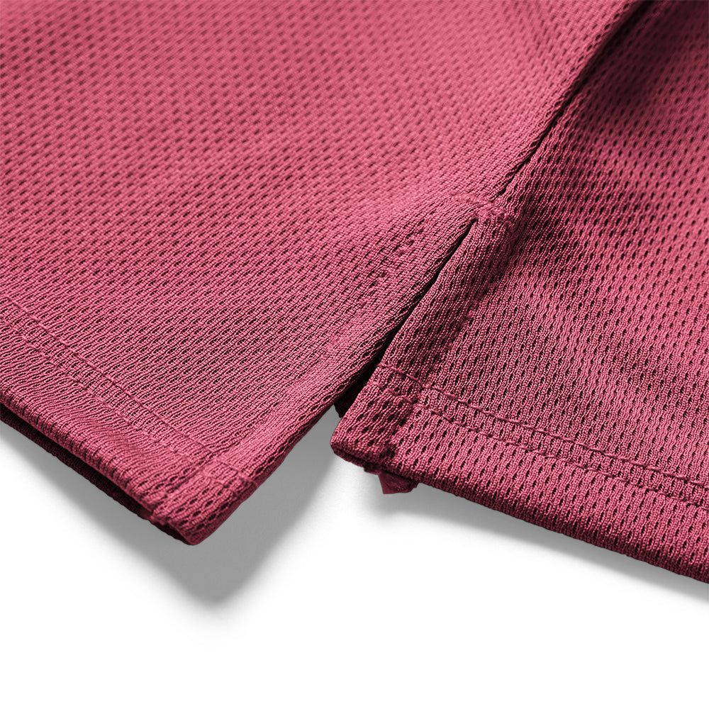 Close-up of a maroon fabric with textured pattern on a white background