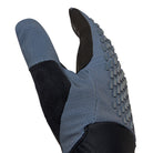 Blue slip-on shoe with textured sole on a white background