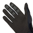 Black glove with textured palm on a white background