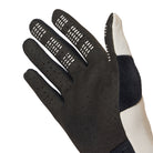Black glove with textured palm and white cuff on a white background