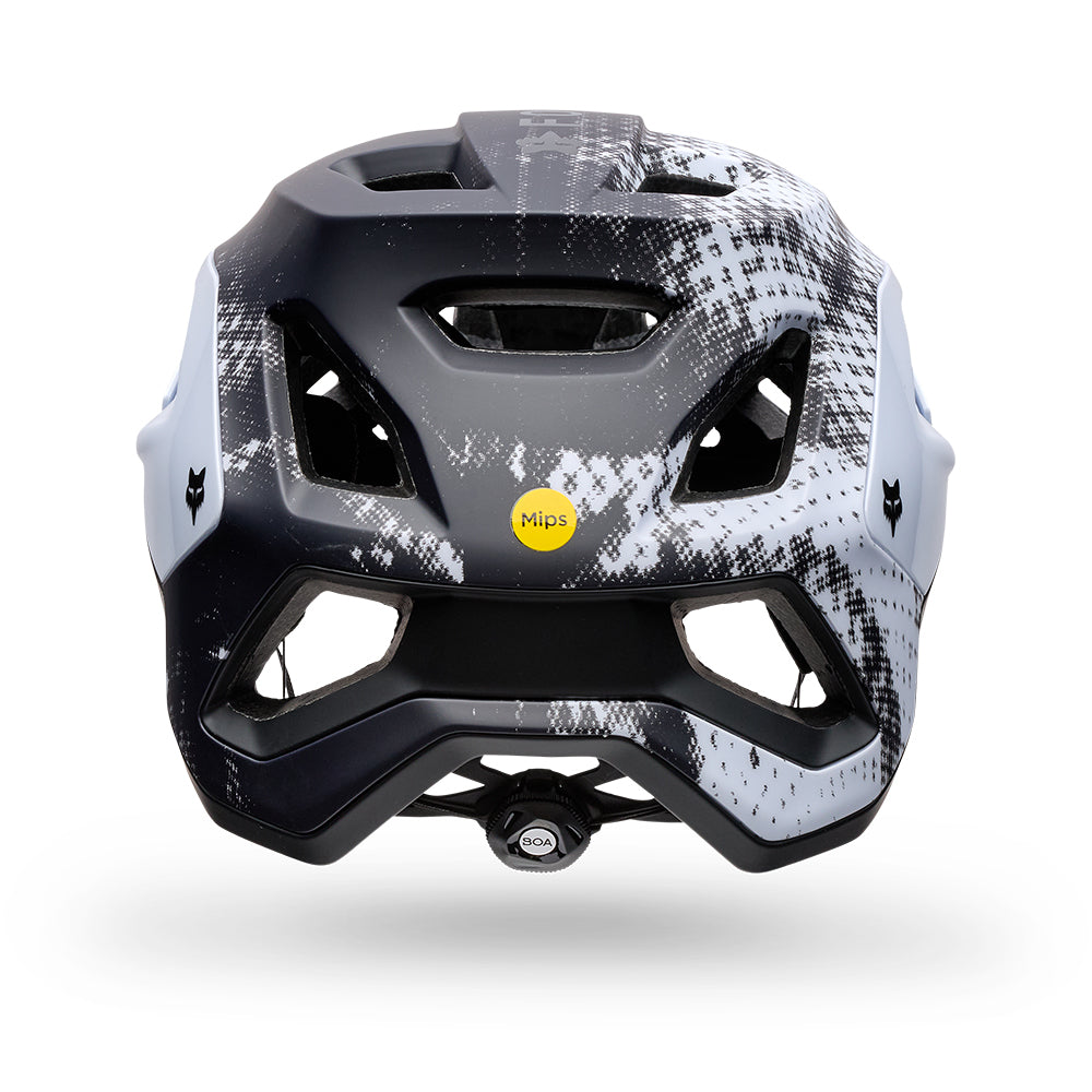 Black and white helmet with a yellow Mips logo on a white background