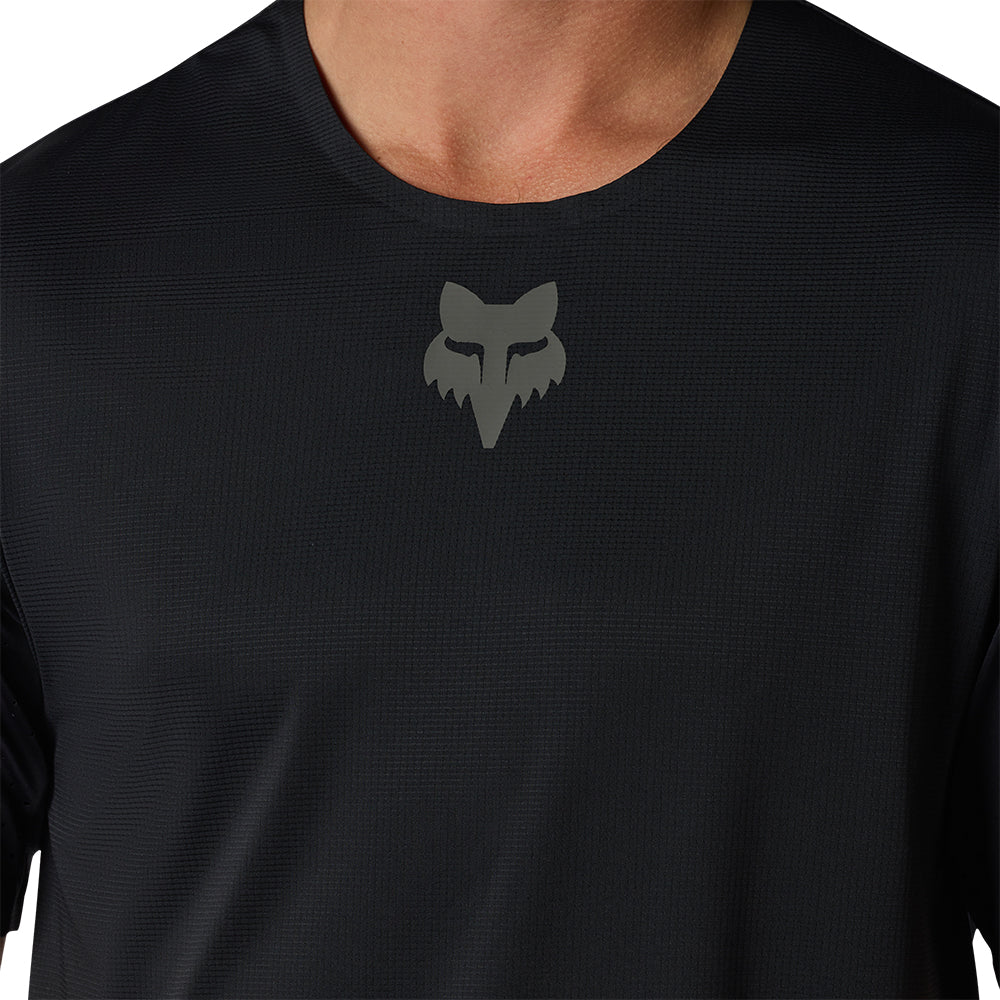Black long-sleeve shirt with a logo on the chest against a white background