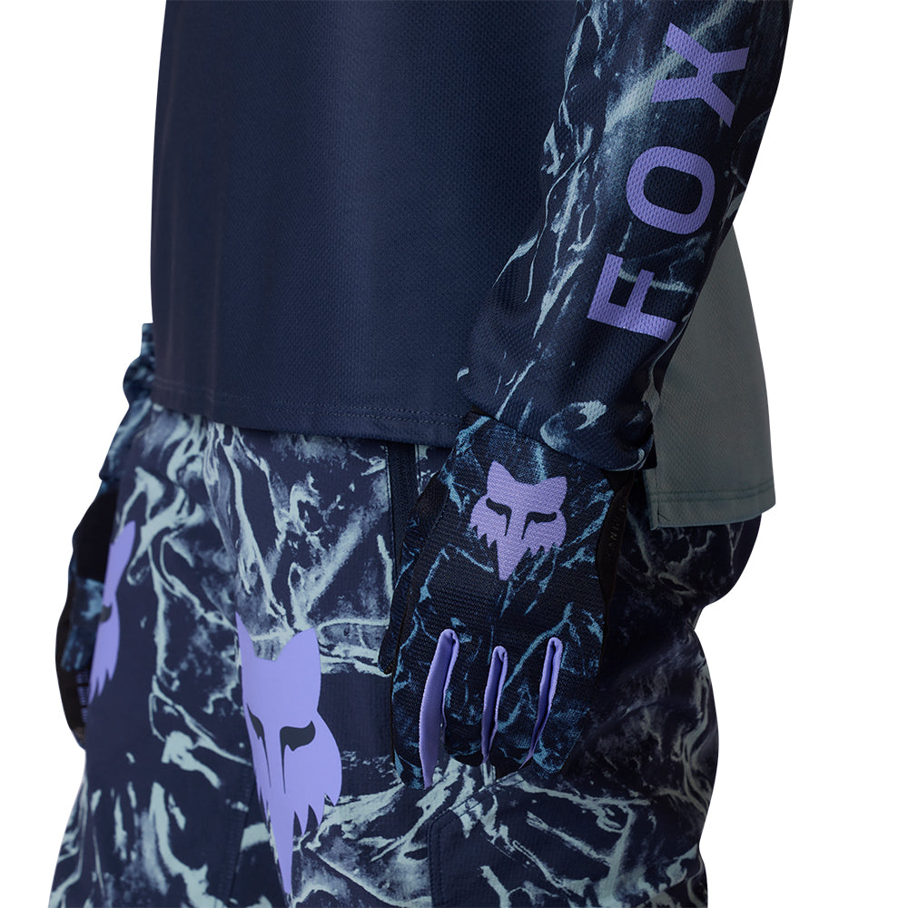 Navy blue pants with a pattern and 'FOX' branding on a white background
