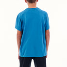 Person wearing a blue t-shirt on a white background