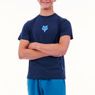 Person wearing a navy blue t-shirt with a logo on a white background