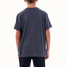Person wearing a plain dark gray t-shirt on a white background