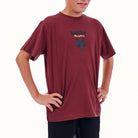 Person wearing a maroon t-shirt with a logo on a white background