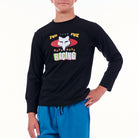 Person wearing a black long-sleeve shirt with a graphic design on a white background
