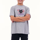 Person wearing a gray t-shirt with a racing team logo on a white background