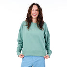 Person wearing a green sweatshirt with 'FOX' logo on a white background