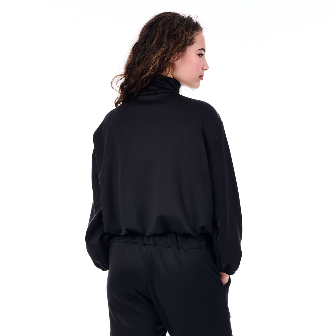 Person wearing a black outfit on a white background
