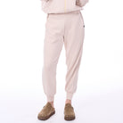 Beige tracksuit with matching jogger pants on a white background