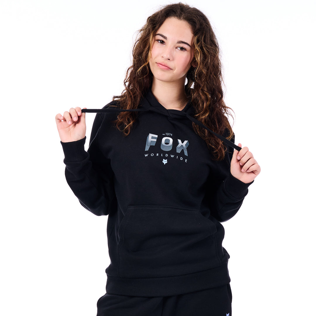 Person wearing a black hoodie with 'Fox Worldwide' logo on a white background