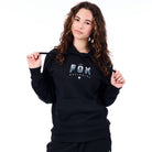 Person wearing a black hoodie with 'Fox Worldwide' logo on a white background