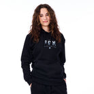 Person wearing a black hoodie with 'FX' logo on a white background