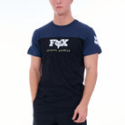 Person wearing a navy t-shirt with a white logo on a white background