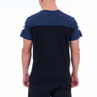 Person wearing a navy blue t-shirt with a black panel on a white background