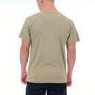 Person wearing a beige t-shirt on a white background