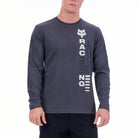 Person wearing a gray long-sleeve shirt with a brand logo and text on a white background