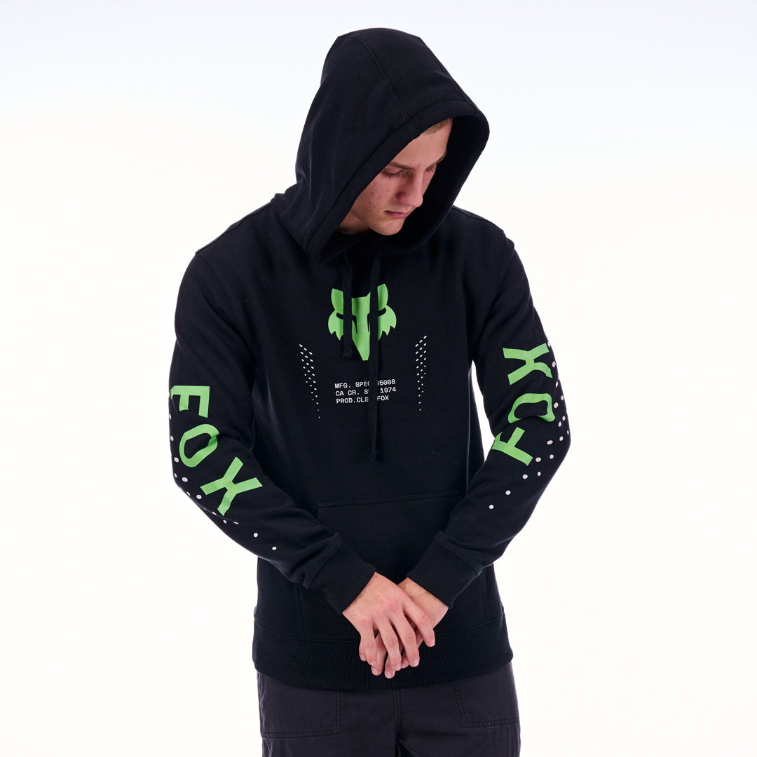 Person wearing a black hoodie with green text and logos on a white background