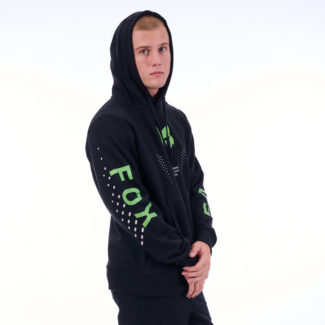 Person wearing a black hoodie with green text on a white background