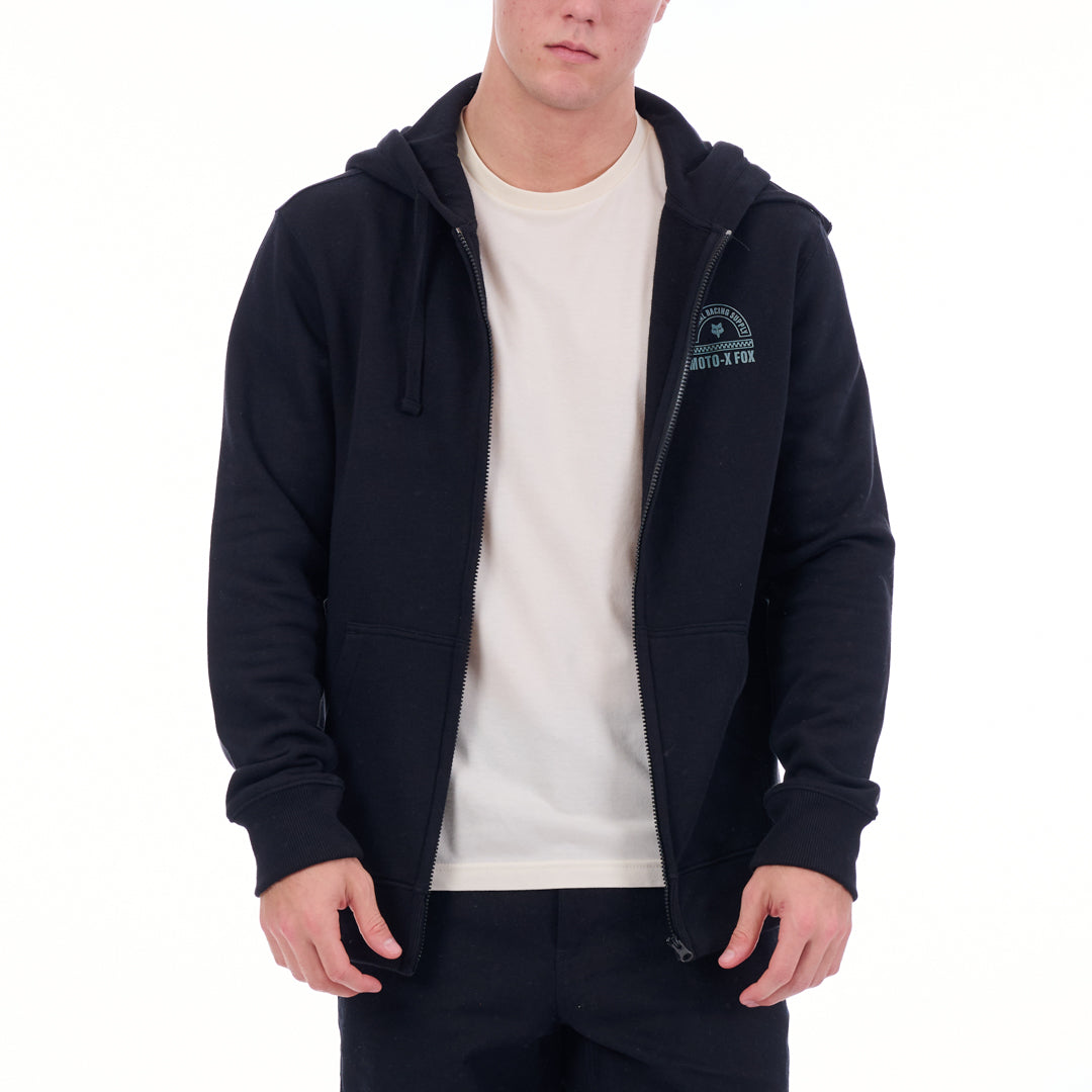 Person wearing a navy blue hoodie with a logo on a white background