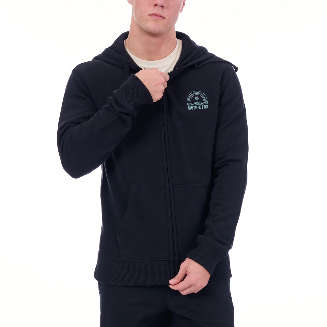 Person wearing a black hoodie with a logo on a white background